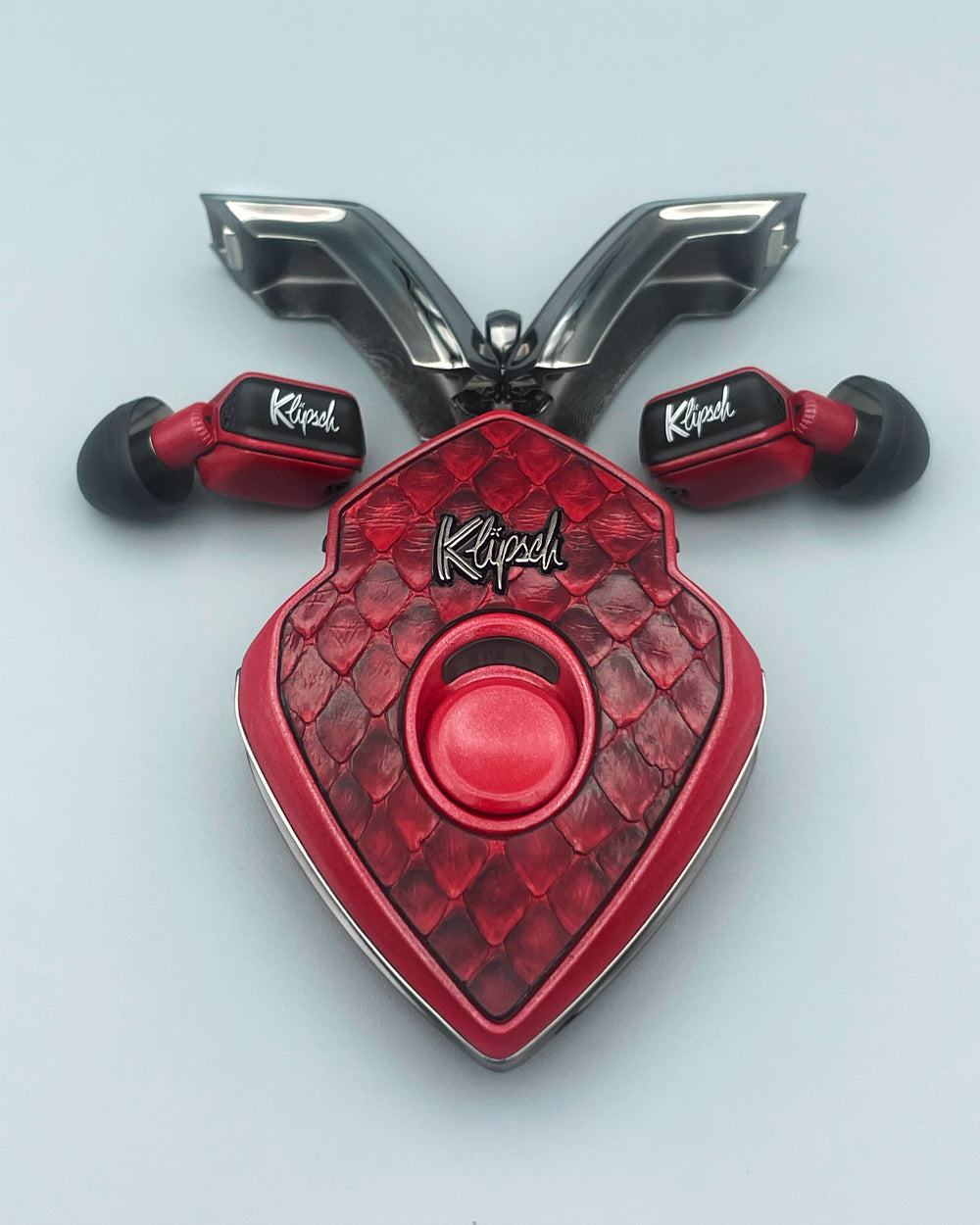Blood Snake earbuds and charging case with red python cover and gunmetal doors open