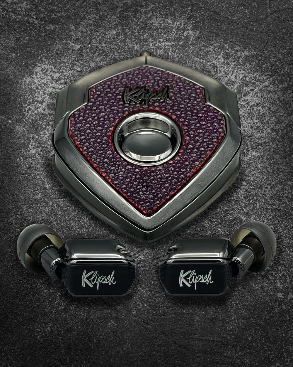 Power Perse charging case with purple stingray-texture face and gunmetal frame, black earbuds