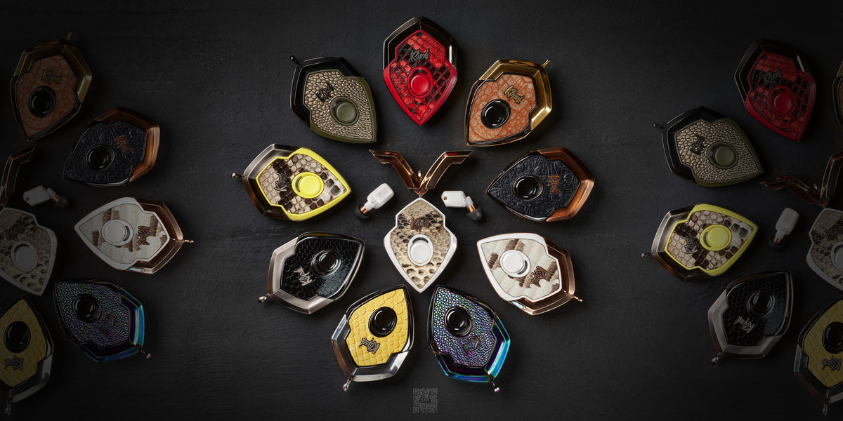 Rows of T10 Bespoke charging cases in exotic leathers and metals arranged in a circle