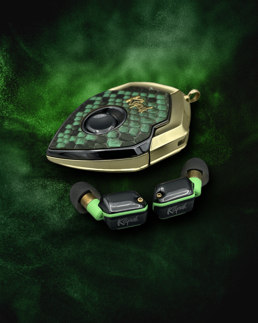 Green Anaconda charging case with anaconda face and brass frame, with green-trimmed earbuds