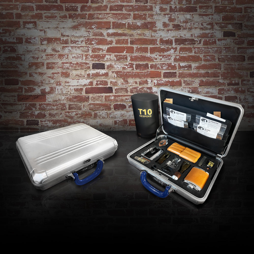 BillionEAR Attaché the Smoker Edition: aluminum briefcases, one open with cigar case, flask, and lighters