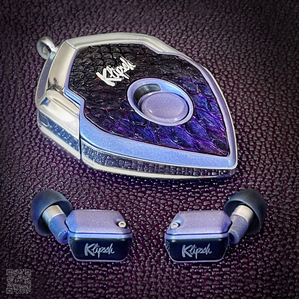 Luna's Indigo charging case with iridescent purple snakeskin face and violet earbuds