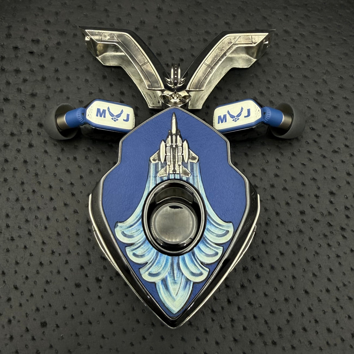F-15 commission: custom leather inserts forming contrails from a cast F-15 emblem across the charger face