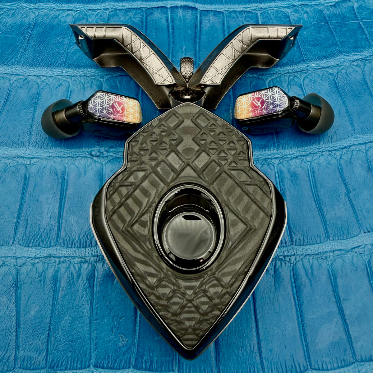 Pavel commission: the geometric pattern enlarged across the charger grab areas and CNC-milled carbon covers