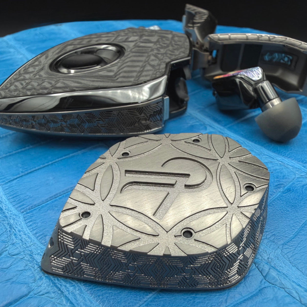 Pavel commission: geometry and initials carved in relief on the underside of the inductive charging station