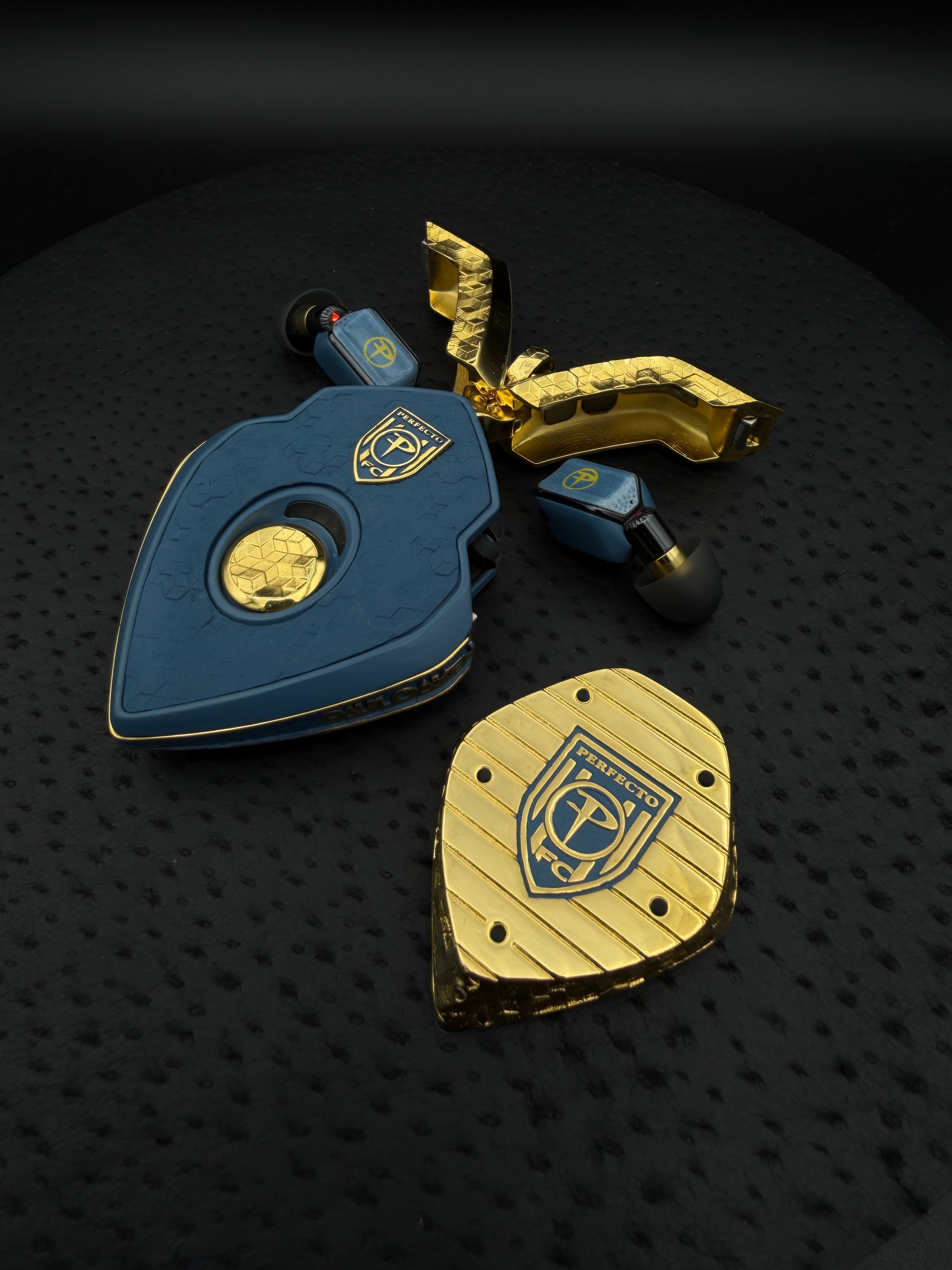 Paul Oakenfold commission: the Perfecto crest on the charger and charging station base, and the Perfecto P on the ear computers