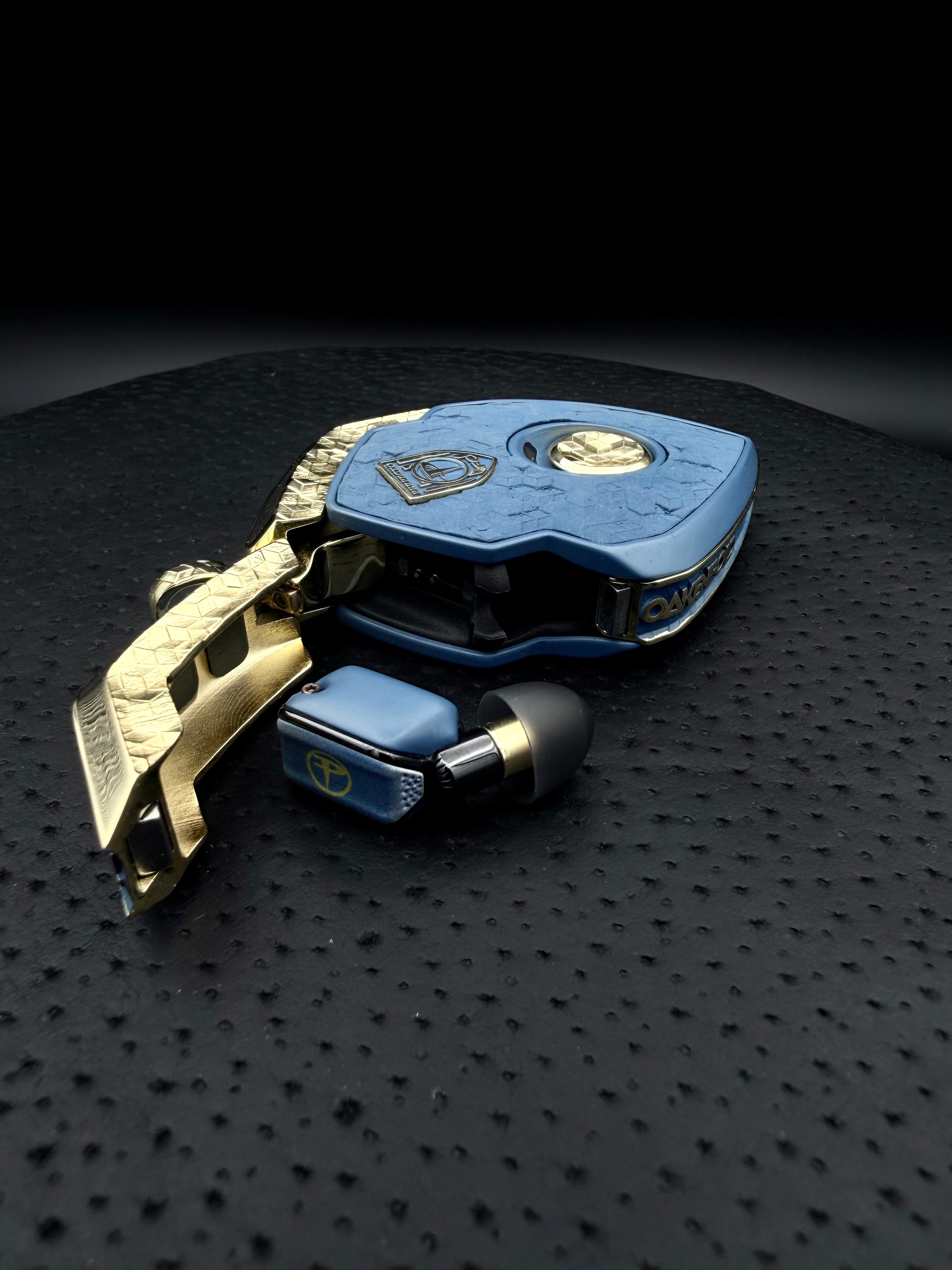 Paul Oakenfold commission: blue Cerakote on the charger and ear computer covers, with triple-plated gold